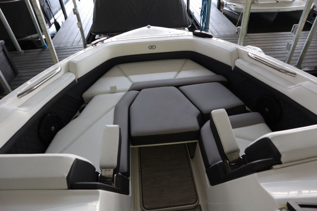 Interior view of a 2021 Cobalt R6 boat, showcasing plush seating and modern design elements.